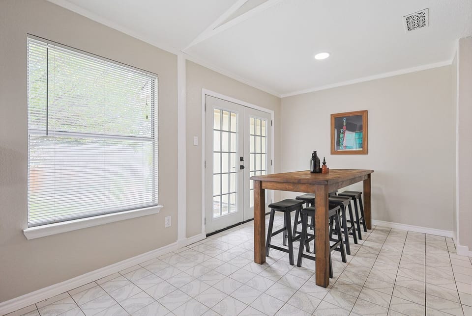 Bright and airy dining room with seating for 6.
