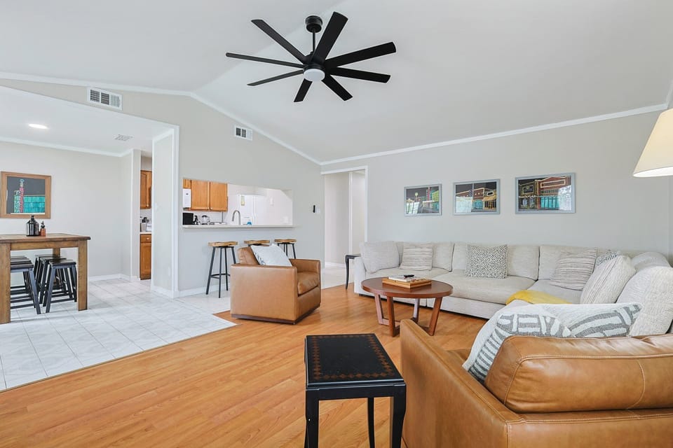Unwind in an open-concept living room featuring plenty of comfortable seating.