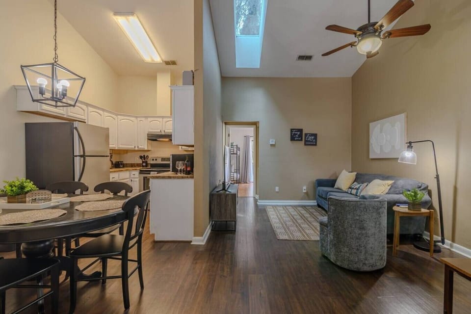 Open layout of Kitchen, Living and dining room with ceiling fan and Smart TV