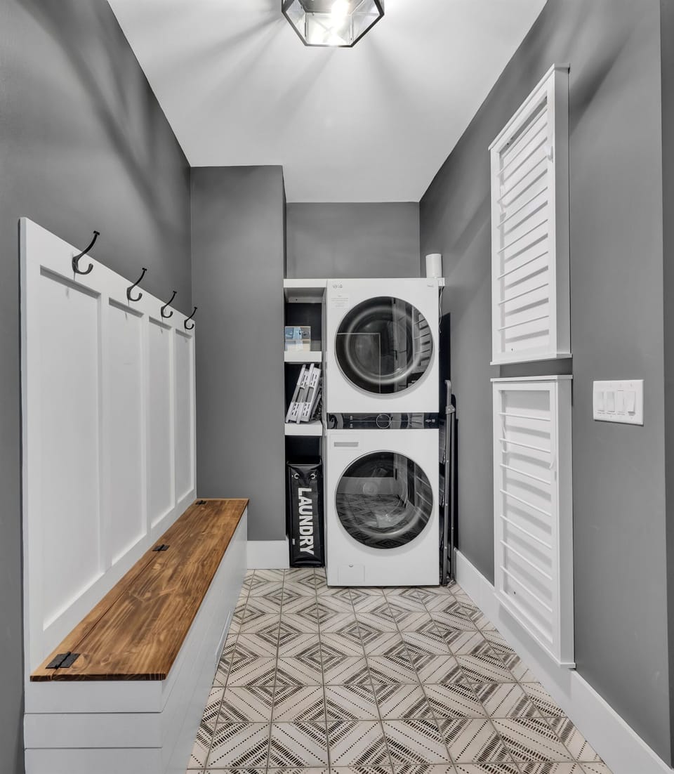 Laundry room and drop zone right off the entry.  A great place to hang bags and jackets on the way in the door.