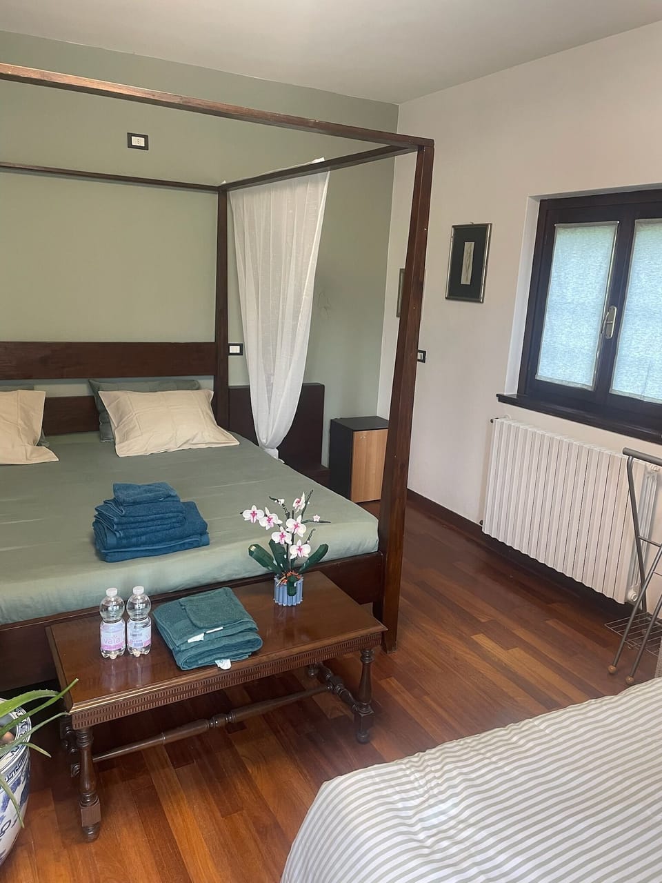 Deluxe Quadruple Room, 1 Bedroom, Patio, Garden View | In-room safe, desk, laptop workspace, WiFi (free)