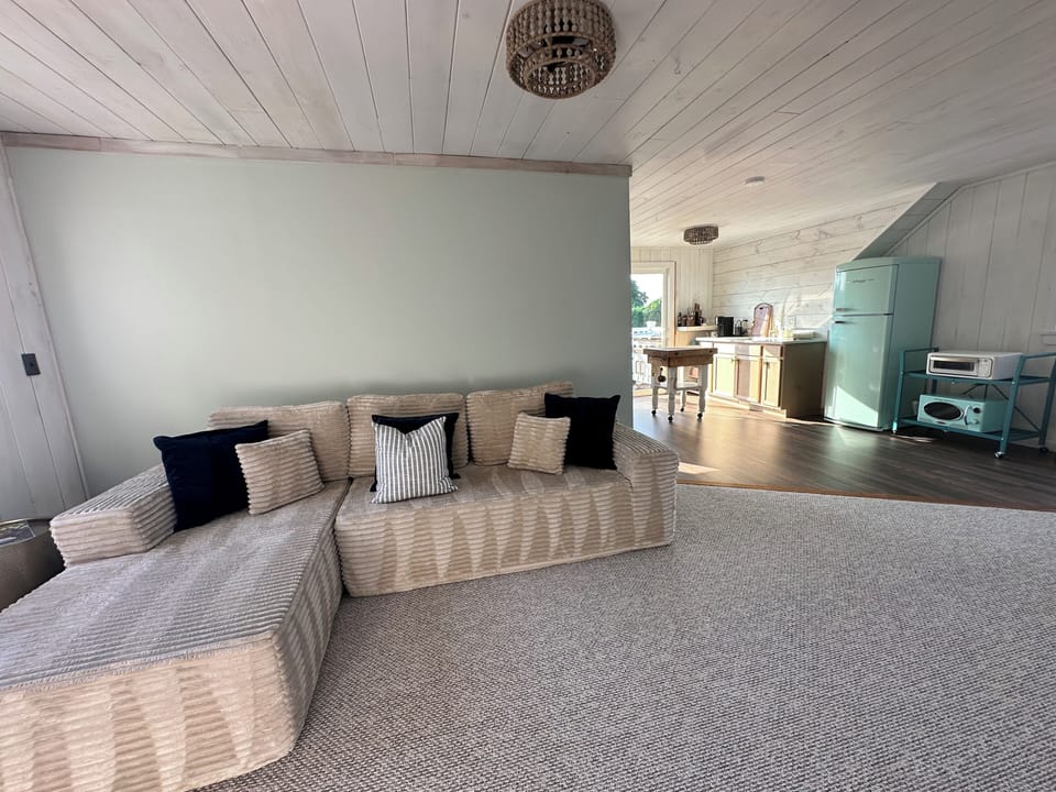 Living room & kitchen with slider to balcony