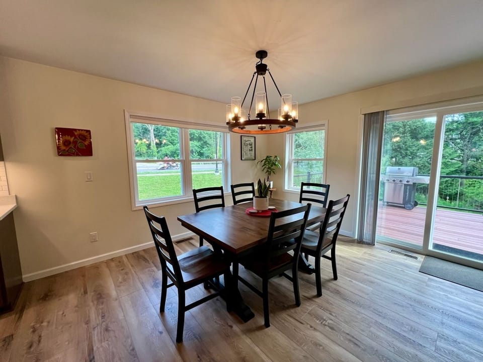 Kitchen table with seating for 6 with access to back porch