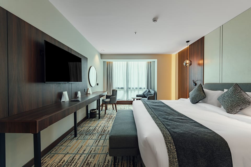 Premium bedding, in-room safe, laptop workspace, soundproofing