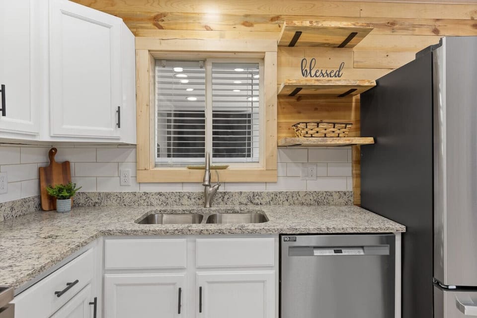 With warm wood accents and crisp white cabinetry, this stylish kitchen is a true chef’s retreat.