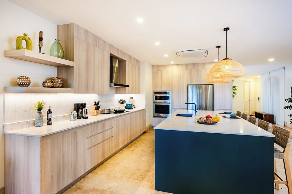 This fully equipped kitchen in the Langosta Beach apartment offers modern appliances and ample space for family meal prep. Ideal for families or groups seeking a comfortable, home-like setting for their Costa Rica beach vacation.