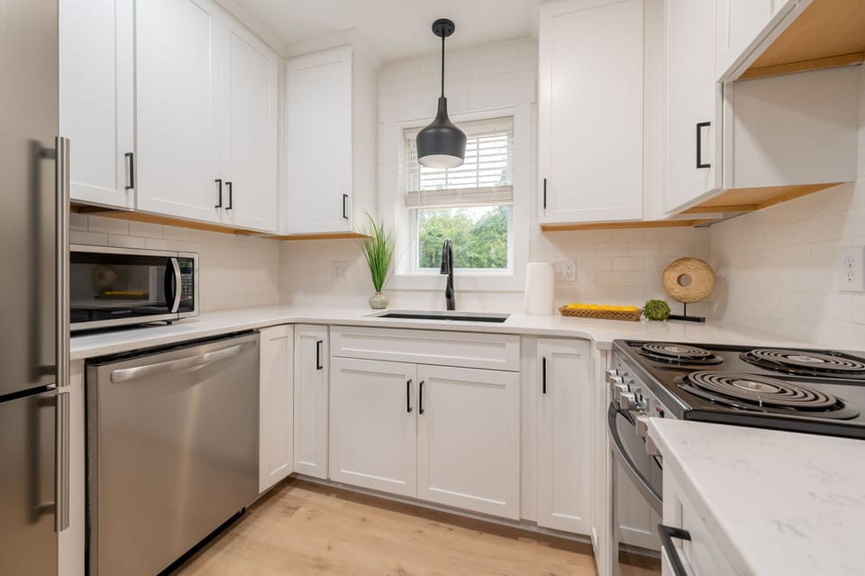 Bright and modern kitchen with stainless steel appliances and plenty of counter space.