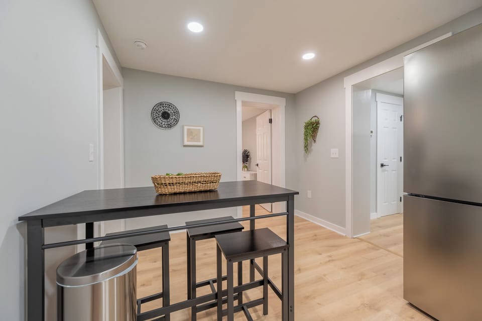 Chic breakfast bar and hallway space connecting kitchen and bedrooms.