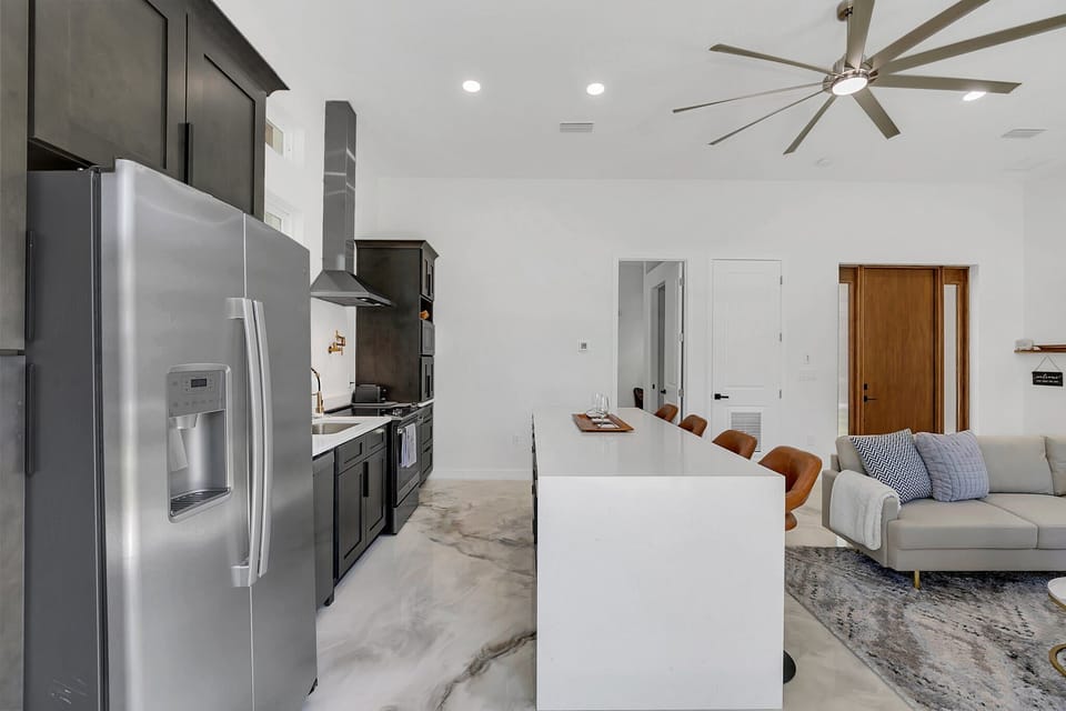 Modern kitchen with a large island and stainless steel appliances