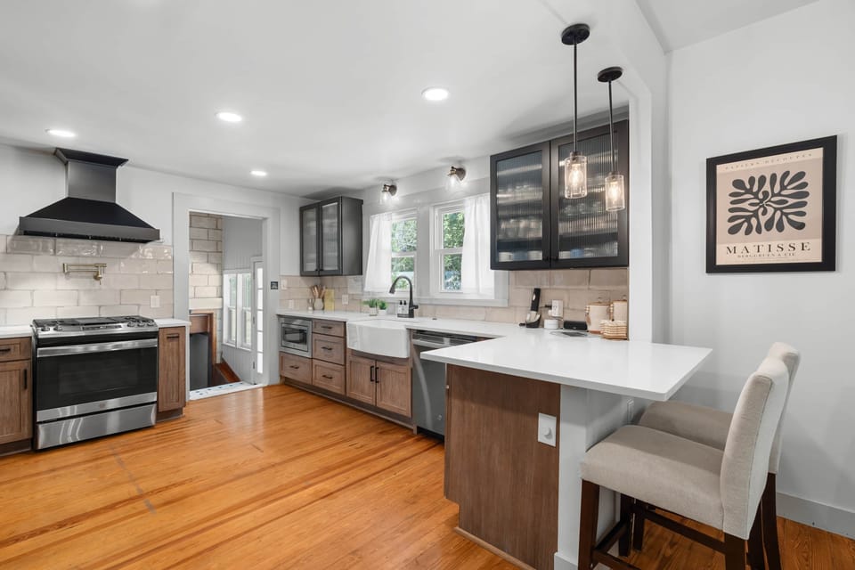 Kitchen comes fully equipped with oven, range, All-Clad pots and high-end utensils