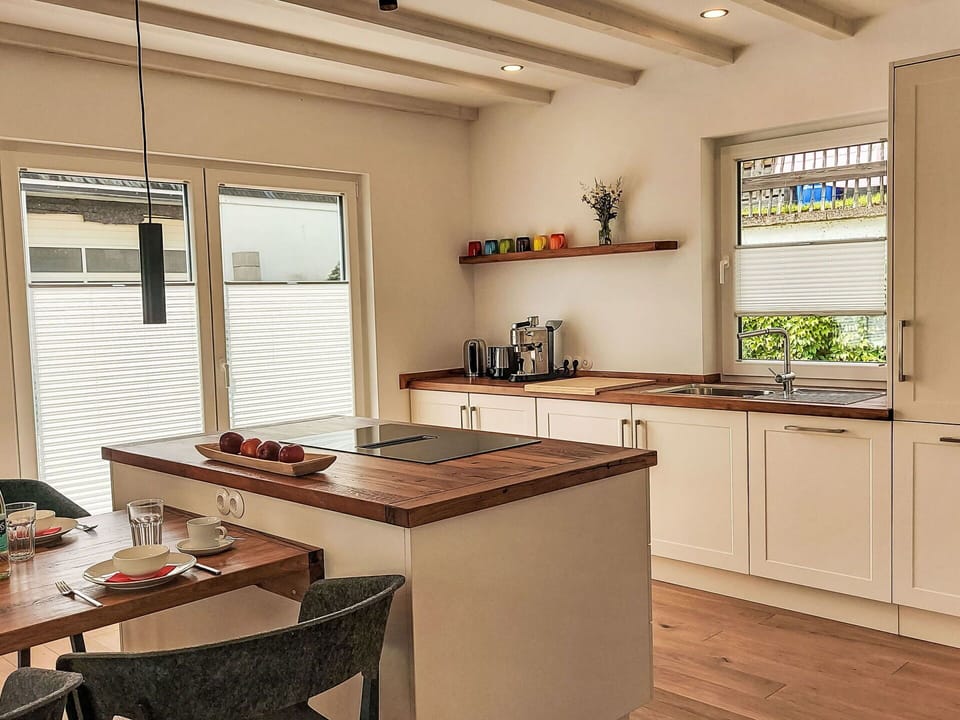 Furniture, Countertop, Interior Design, Kitchen, Wood, Flooring, Ceiling, Cabinetry, Floor, Light Fixture