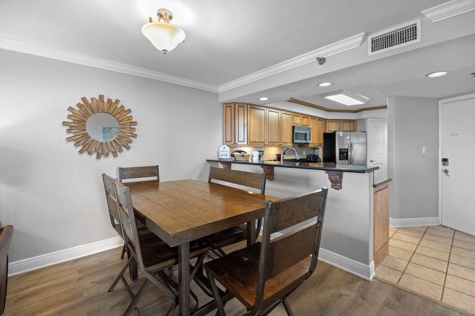 Perdido Sun Resort 300 by PKRM - Breakfast bar separates kitchen from dining / living area.