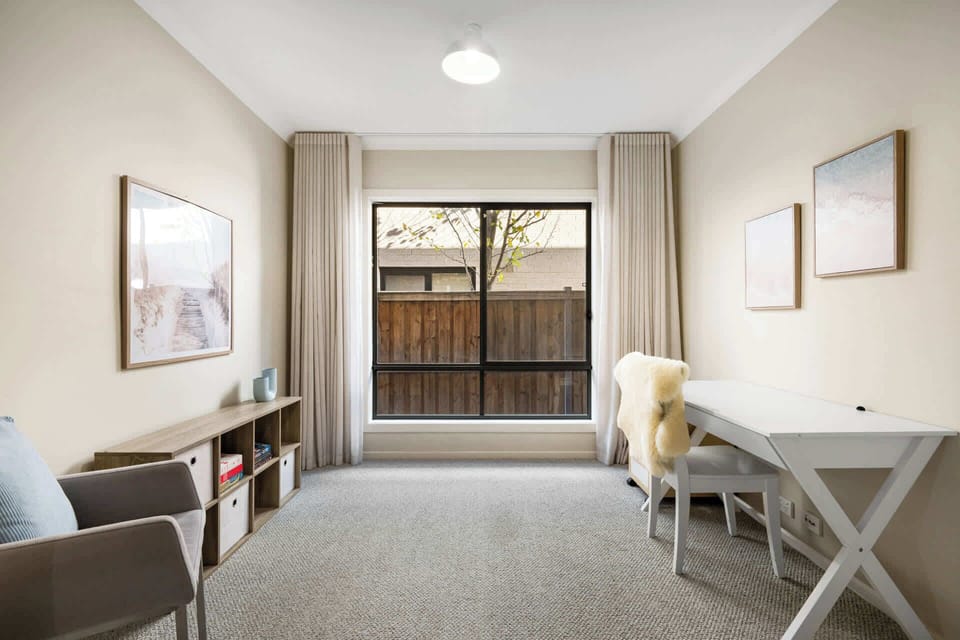 Separate living room with desk/chair and seating area