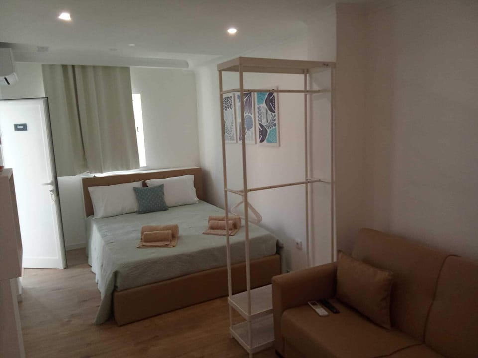 Triple Room, Courtyard View | Blackout drapes, iron/ironing board, free WiFi