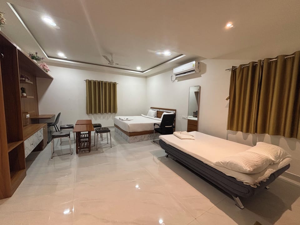 Deluxe Double Room, City View | Living area | TV