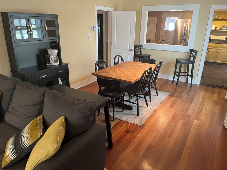 Dining area with serving table and coffee bar pantry cabinet