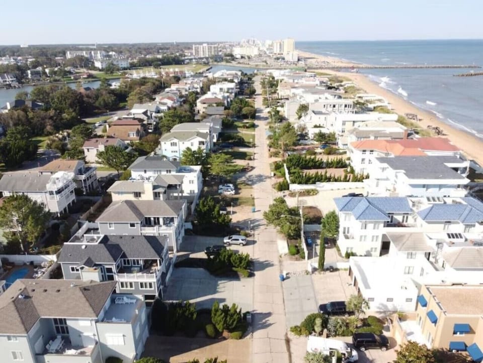 Aerial perspective of charming houses right on the oceanfront.