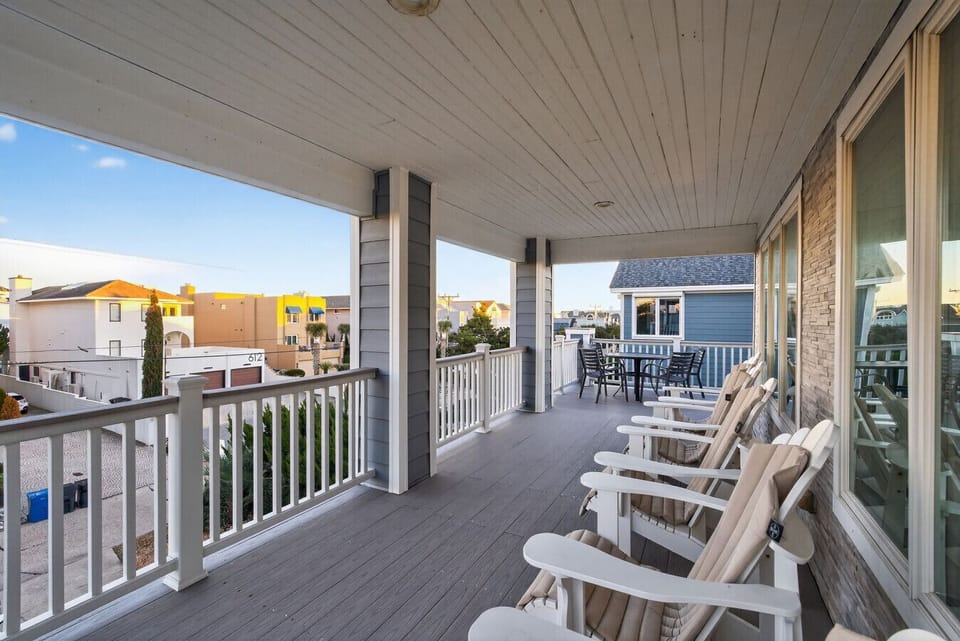 Start your mornings with coffee in the ocean air and end your evenings rocking under the coastal sky. This spacious covered porch is made for slow mornings, sunset conversations, and unwinding after a day at the beach.