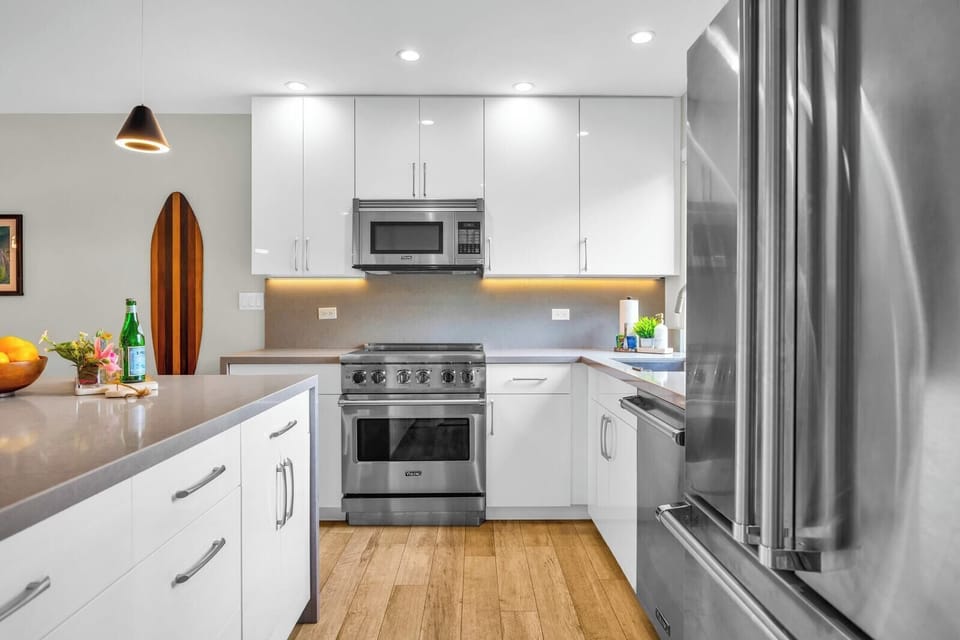 Cook and gather in a bright kitchen filled with island light