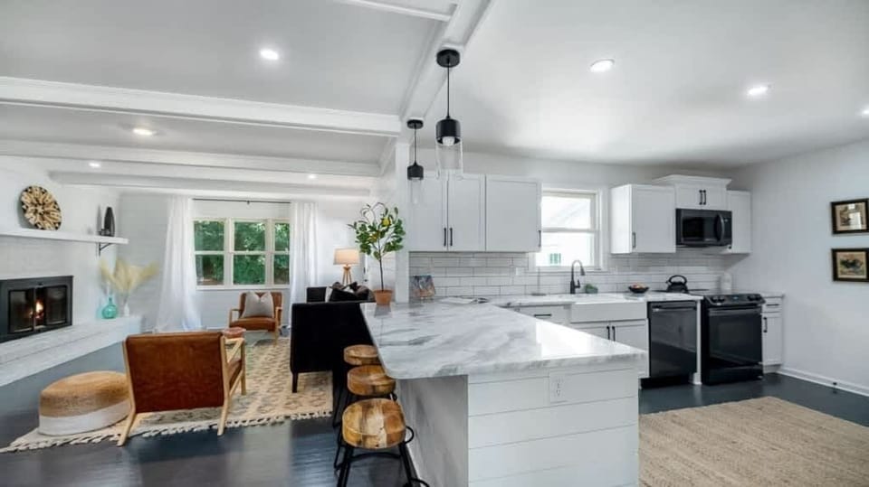 A sleek, fully equipped kitchen with modern appliances and plenty of space to cook and gather.