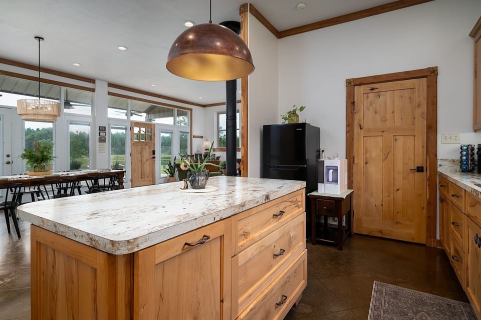 Spacious kitchen with a large island that keeps everyone connected while cooking