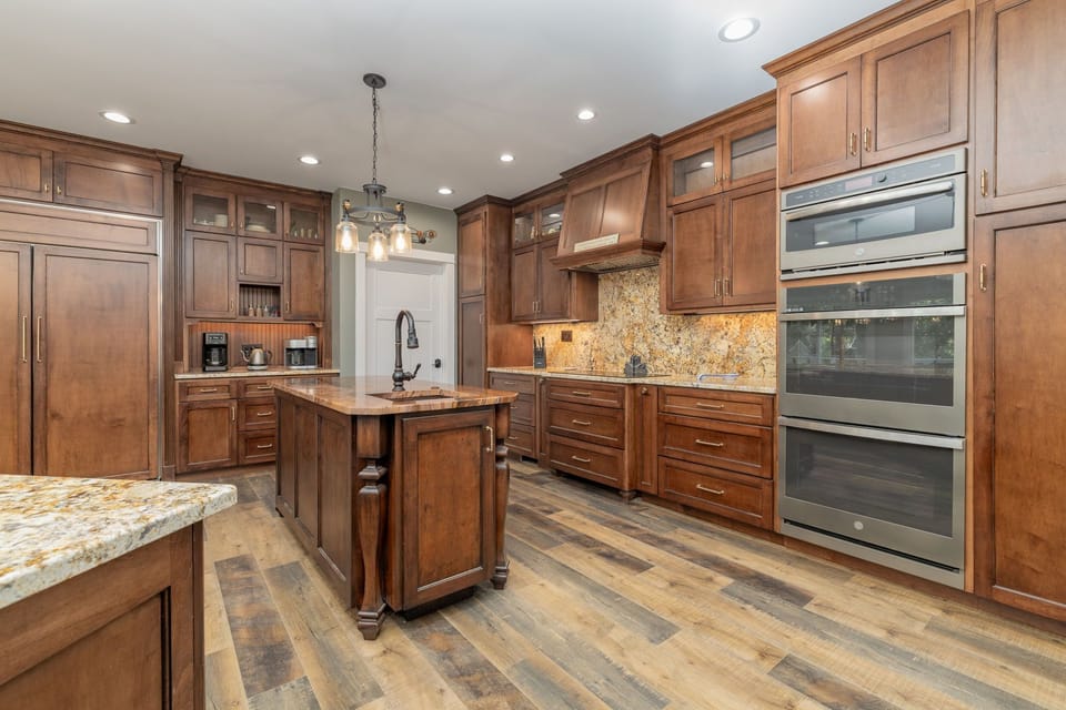 Fully stocked kitchen with 2 islands & bar seating