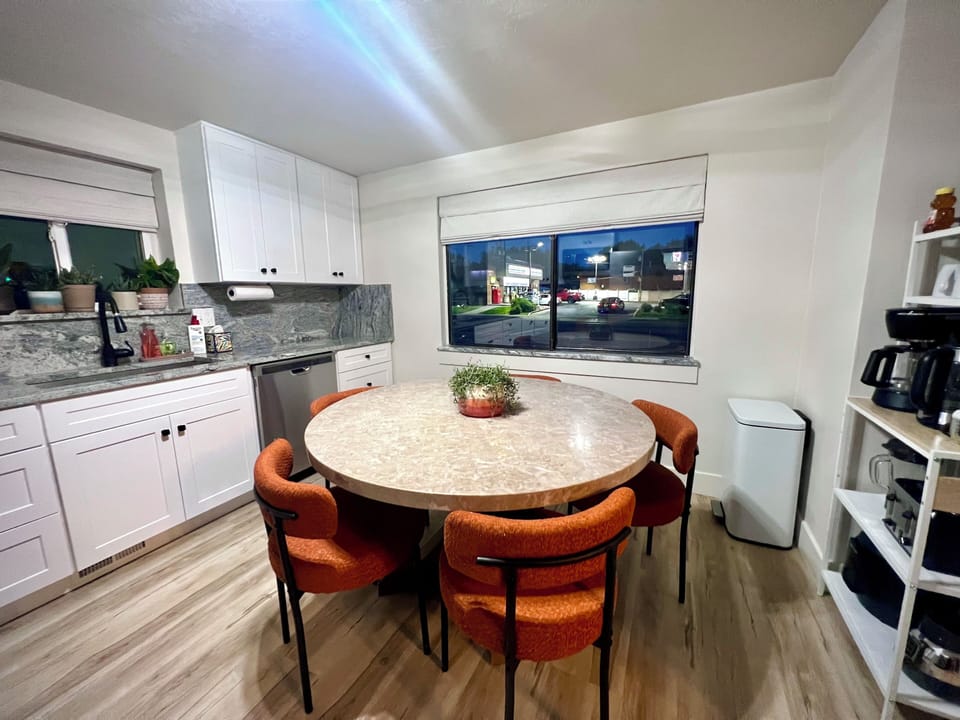 Kitchen and dining area for 5-6 people.  Fully stocked coffee/tea bar. 