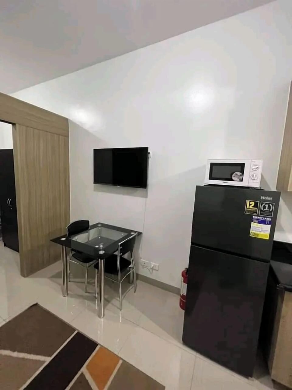 Comfort Apartment, Pool View | Living area | 55-inch Smart TV with satellite channels