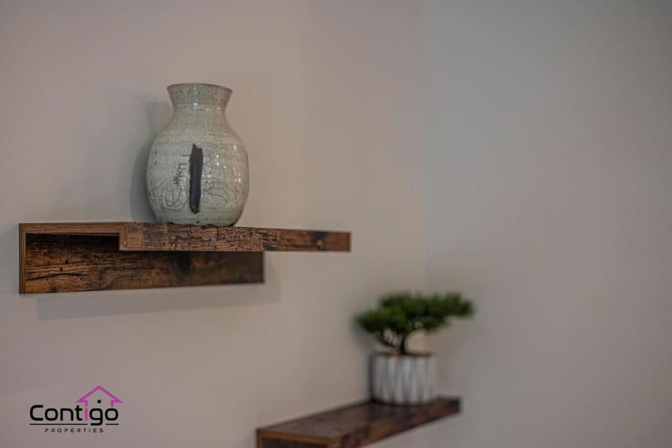 Beautifully styled shelves add charm to your restful retreat.