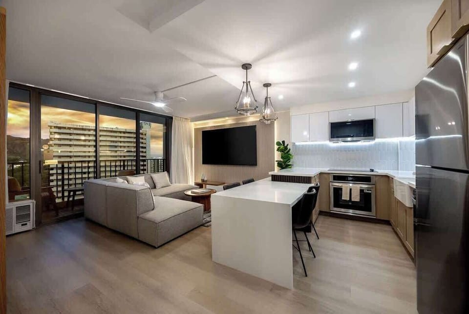 Unwind in contemporary luxury with captivating city lights illuminating your evenings.