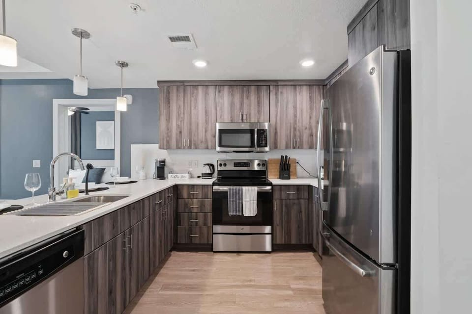 Wake up to fresh coffee in our kitchen,  stocked with utensils, a dishwasher, and an oven for all your culinary needs.