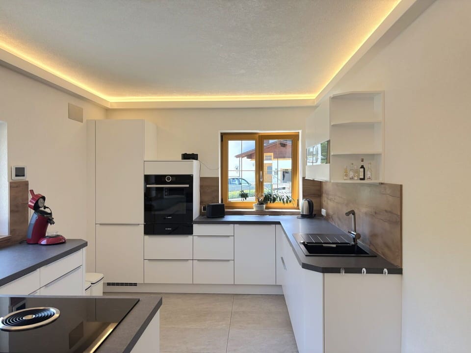 Interior Design, Flooring, Kitchen, Ceiling, Wood, Countertop, Light Fixture, Floor, Home, Lighting