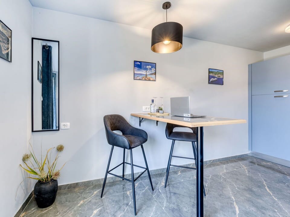 Furniture, Interior Design, Flooring, Wall, Floor, Wood, Chair, Ceiling, Table, Room