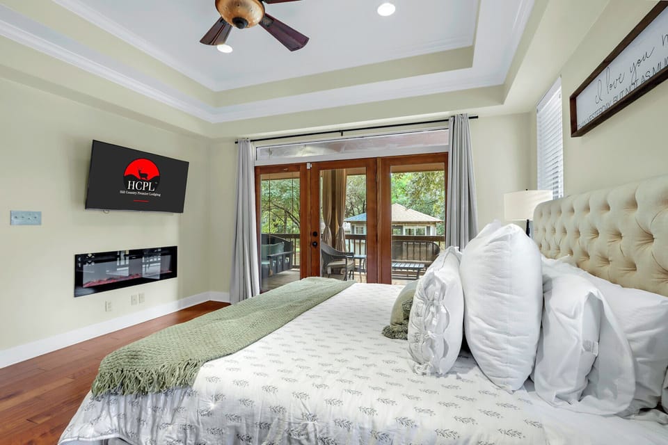 The room features a fireplace and TV