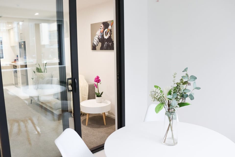 Dining area with a table and seating for four—perfect for shared meals or a quiet workspace.