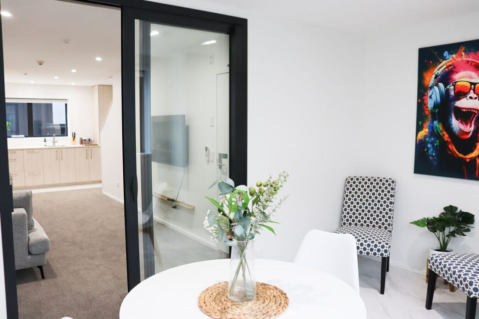 Bright dining area with a table and comfortable seating, perfect for enjoying meals or gathering with friends.