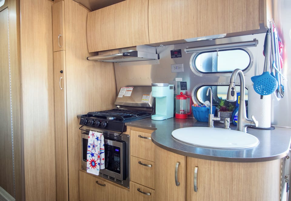 Kitchen with stove, oven, and coffee supplies