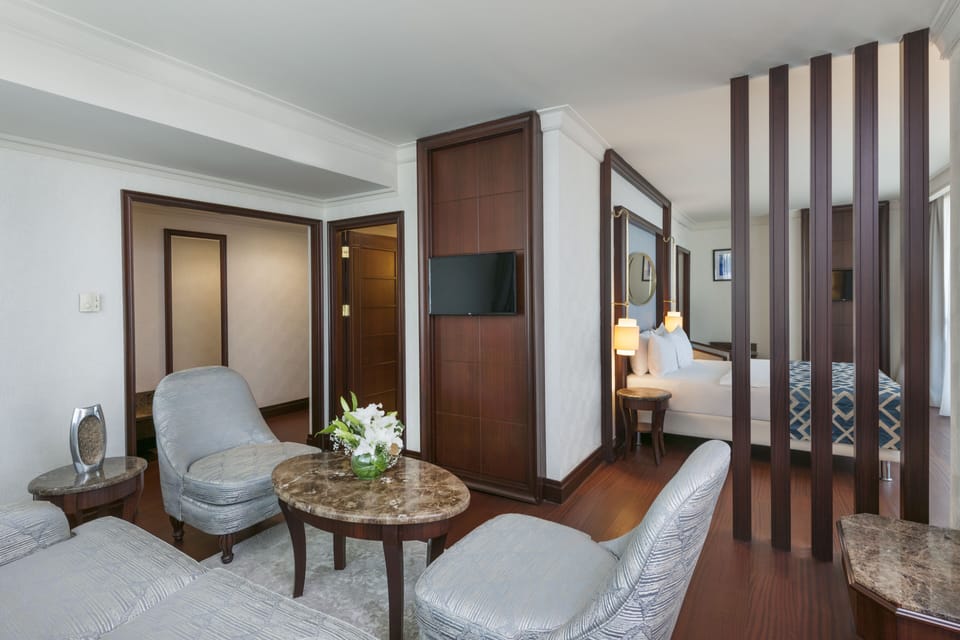 Junior Suite with Queen Size Bed | Living area | 42-inch LCD TV with satellite channels, TV