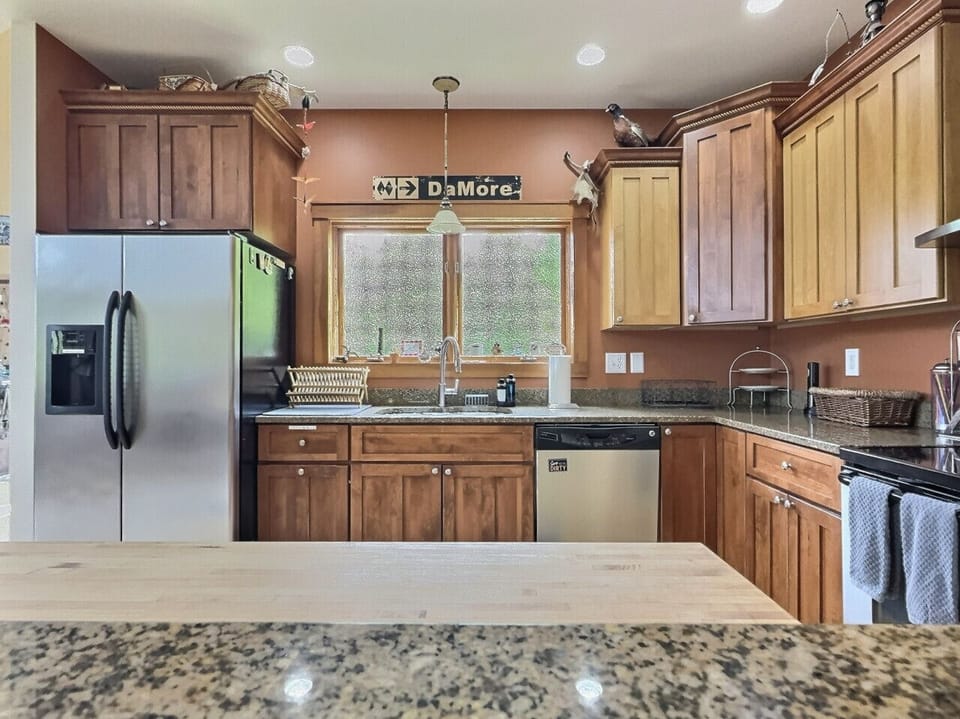 Fully equipped kitchen with stainless steel appliances.