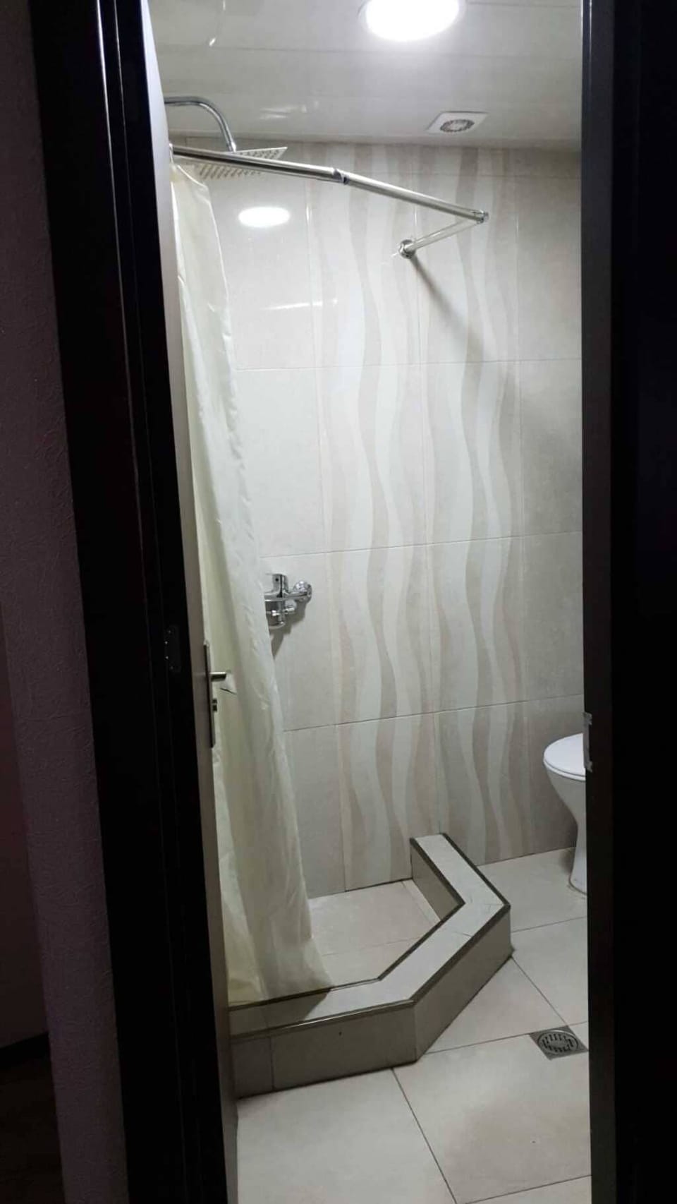Basic Twin Room | Bathroom | Shower, hair dryer, slippers, towels