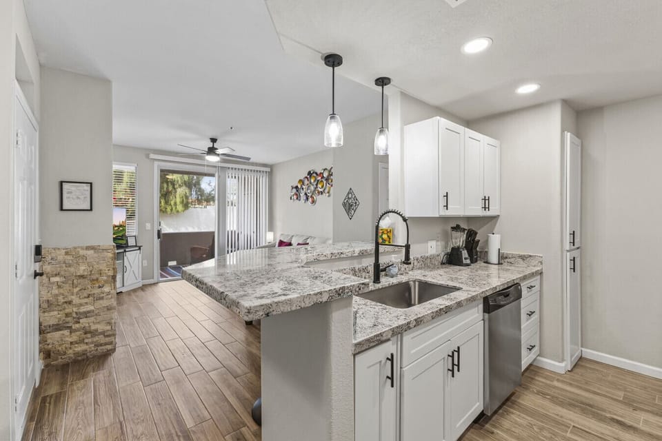 Open living area with kitchen, dining and living areas