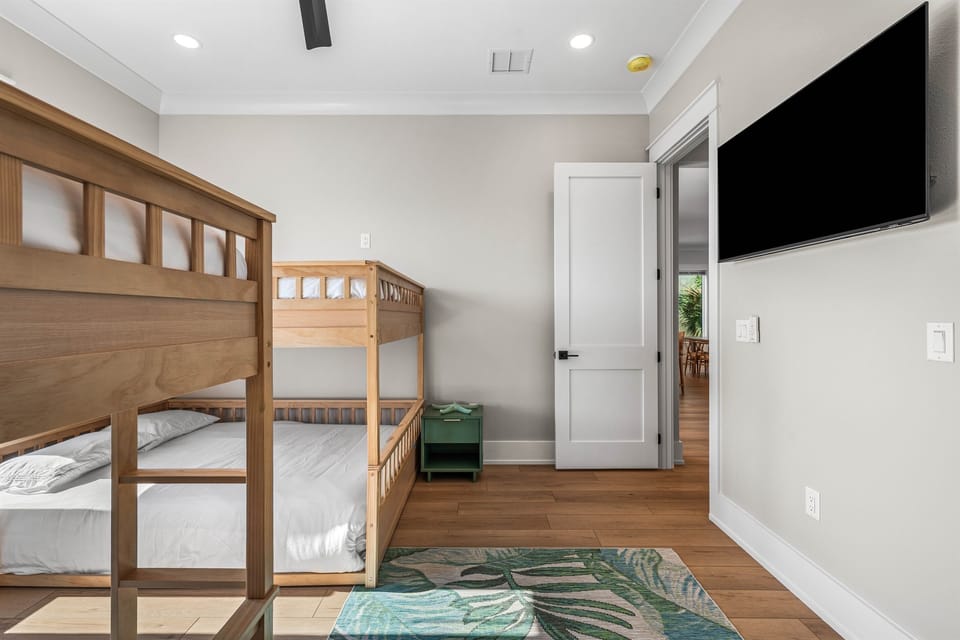 Your kids will love this bright bedroom with sturdy bunk beds, perfect for bedtime stories and morning adventures.