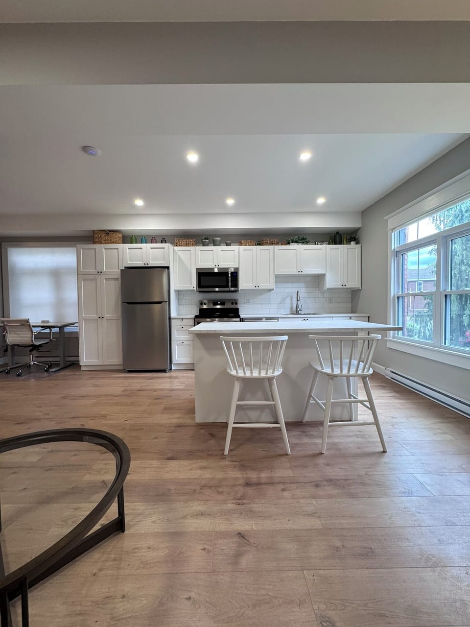 East view from living room to kitchen and office areas
