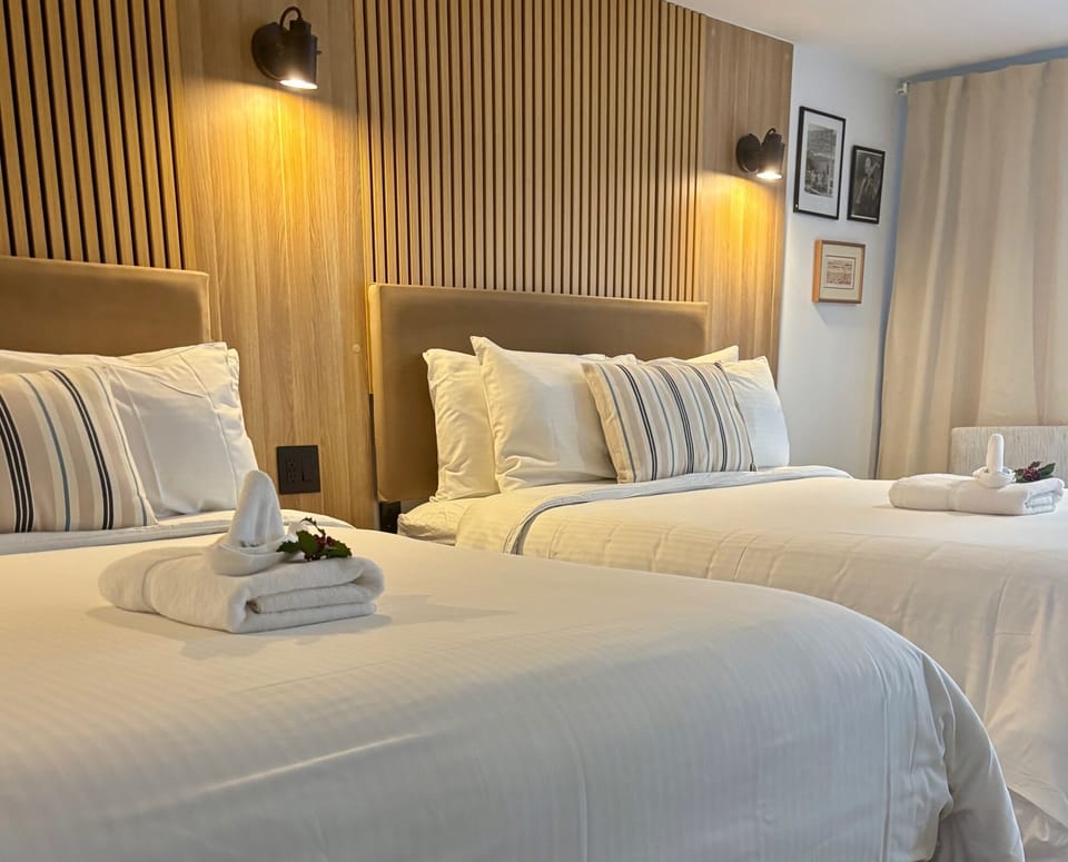 Deluxe Room, 2 Queen Beds | Blackout drapes, iron/ironing board (on request), WiFi (free)