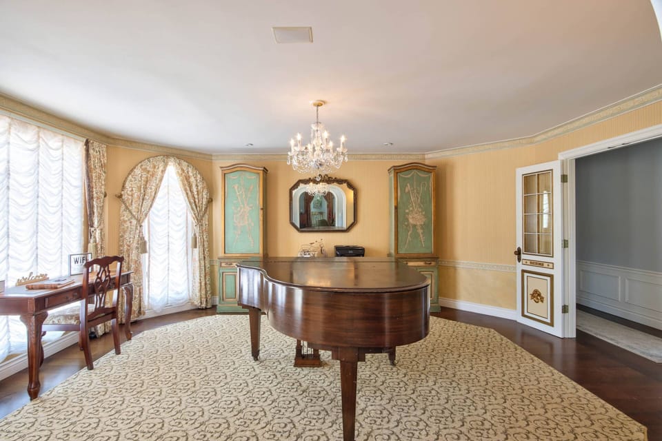 Piano room also an office with desk and printer for your convenient.