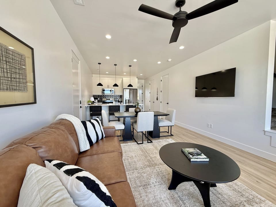 Enjoy luxury at Holiday H3 at Catori a modern townhouse with an open-concept living, dining, and kitchen area in Kanab, UT.