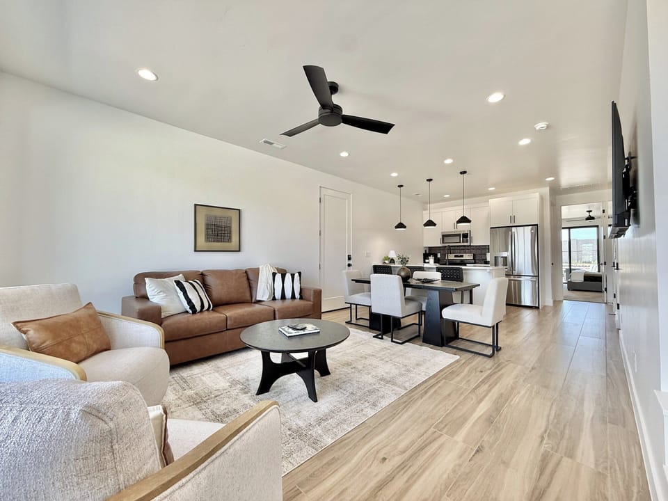 Experience luxury at Holiday H3. Open living, dining, and kitchen area with high-end furnishings in Kanab, UT.