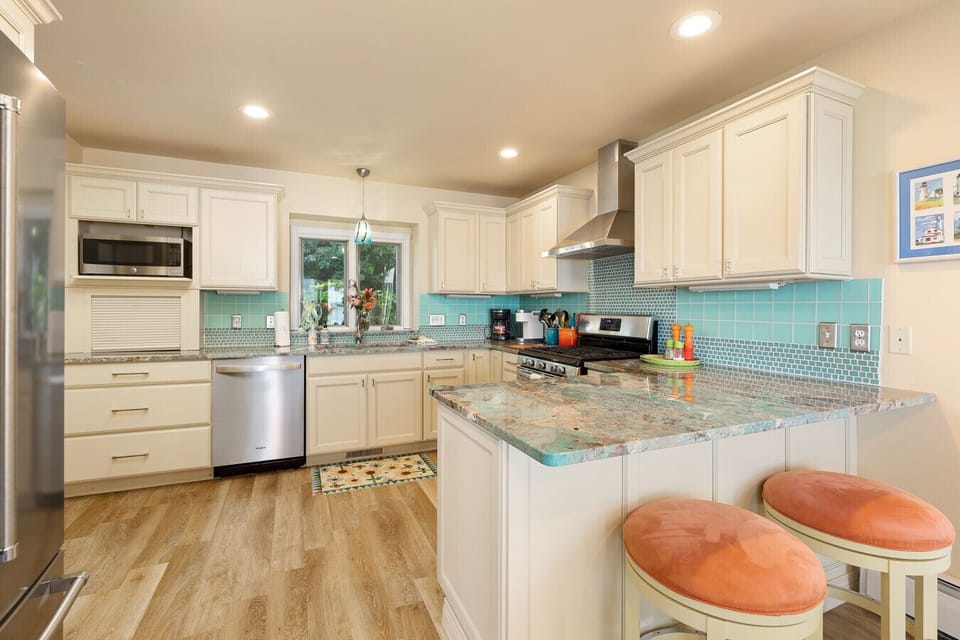 Beach themed, fully stocked kitchen for your family meals.