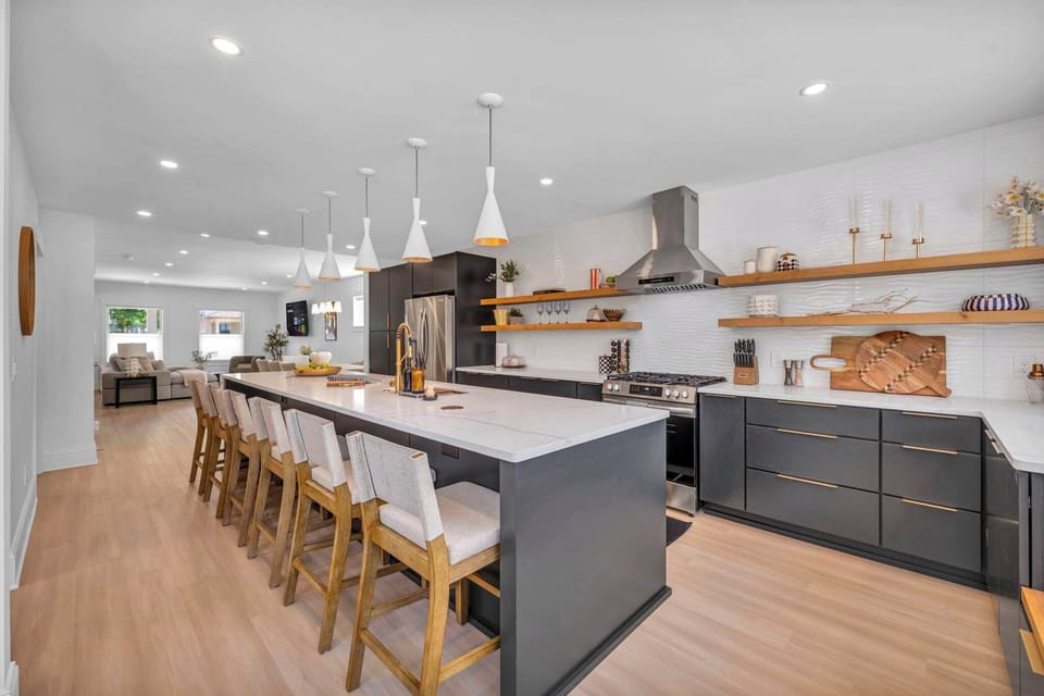 Where Modern Luxury Meets Warm Hospitality From the elegant open shelving to the chef-grade range, every detail has been thoughtfully designed for gatherings big and small.