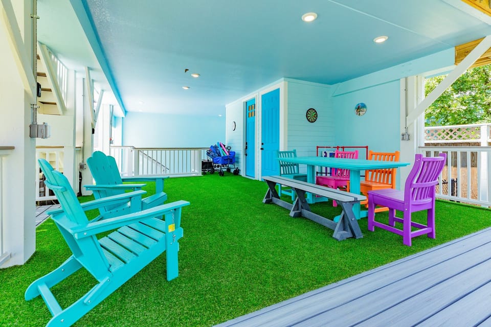 Sit a spell in the comfortable seating and Astroturf play area under the Main House.